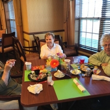 60's Themed Picnic-Oak Park Senior Living-Enjoying food